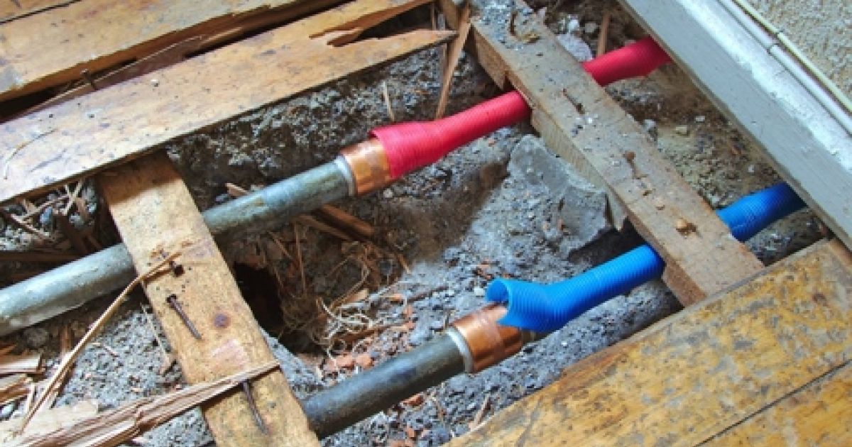 bursted pipes under wood